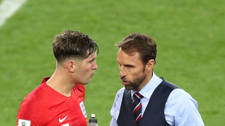 England manager Gareth Southgate speaks to defender John Stones
