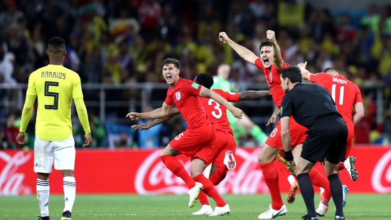 John Stones and Harry Maguire celebrate after Eric Dier scores the decisive penalty to send England through to the 2018 World Cup quarter-final