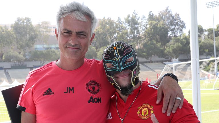 Manchester United manager Jose Mourinho poses with wrestler Rey Mysterio during a pre-season training session at UCLA on July 26, 2018