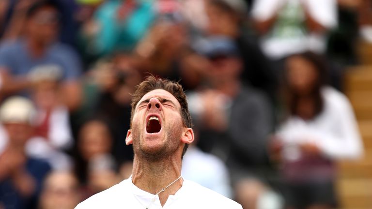 Juan Martin del Potro of Argentina celebrates after defeating Gilles Simon of France in their Men's Singles fourth round match on day eight of the Wimbledon Lawn Tennis Championships at All England Lawn Tennis and Croquet Club on July 10, 2018 in London, England.