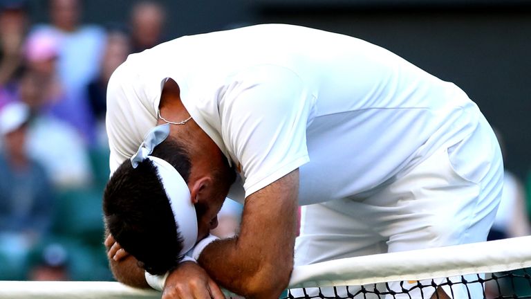 Juan Martin del Potro of Argentina reacts against Rafael Nadal of Spain during their Men's Singles Quarter-Finals match on day nine of the Wimbledon Lawn Tennis Championships at All England Lawn Tennis and Croquet Club on July 11, 2018 in London, England