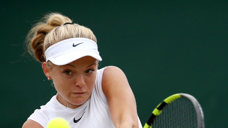 Katie Swan of Great Britain plays a backhand during the Girl's Singles second round match against Catherine McNally on day eight of the Wimbledon Lawn Tennis Championships at the All England Lawn Tennis and Croquet Club on July 11, 2017 in London, England.