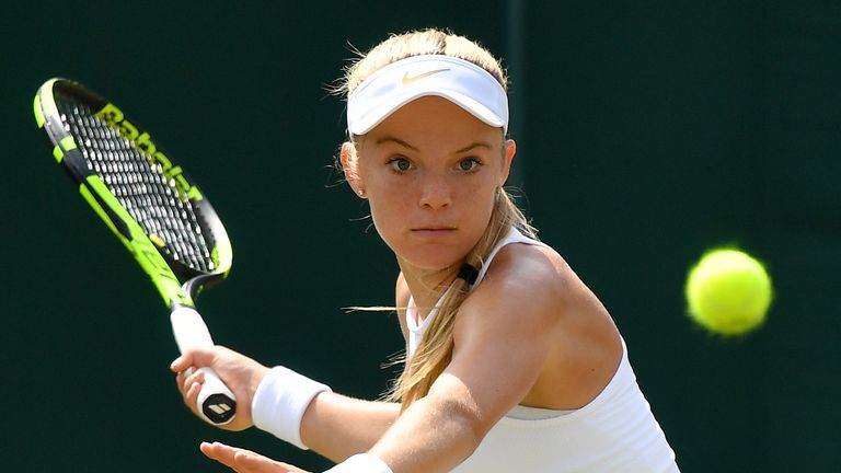 Britain's Katie Swan returns against Romania's Mihaela Buzarnescu during their women's singles second round match on the third day of the 2018 Wimbledon Championships at The All England Lawn Tennis Club in Wimbledon, southwest London, on July 4, 2018. 