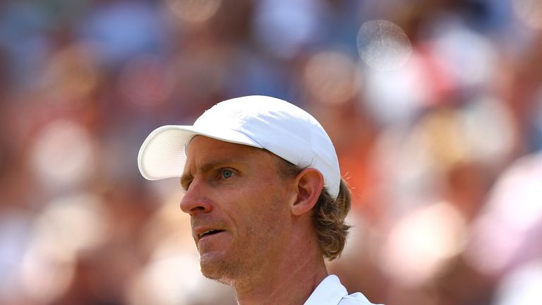 Kevin Anderson of South Africa celebrates winning the third set against Roger Federer of Switzerland during their Men's Singles Quarter-Finals match on day nine of the Wimbledon Lawn Tennis Championships at All England Lawn Tennis and Croquet Club on July 11, 2018 in London, England.