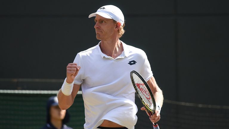 South Africa's Kevin Anderson reacts after winning the fourth set against Switzerland's Roger Federer during their men's singles quarter-finals match on the ninth day of the 2018 Wimbledon Championships at The All England Lawn Tennis Club in Wimbledon, southwest London, on July 11, 2018.