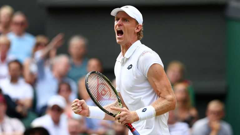 Kevin Anderson of South Africa celebrates winning a break point against John Isner of The United States during their Men's Singles semi-final match on day eleven of the Wimbledon Lawn Tennis Championships at All England Lawn Tennis and Croquet Club on July 13, 2018 in London, England