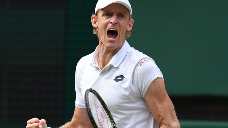 South Africa's Kevin Anderson celebrates winning a point against US player John Isner during their men's singles semi-final match on the eleventh day of the 2018 Wimbledon Championships at The All England Lawn Tennis Club in Wimbledon, southwest London, on July 13, 2018. 