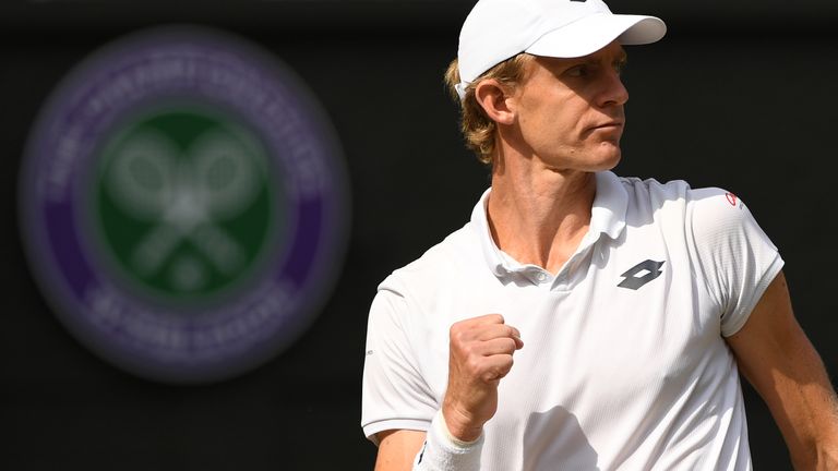 South Africa's Kevin Anderson celebrates going 8-7 in the third set tie break against US player John Isner during their men's singles semi-final match on the eleventh day of the 2018 Wimbledon Championships at The All England Lawn Tennis Club in Wimbledon, southwest London, on July 13, 2018