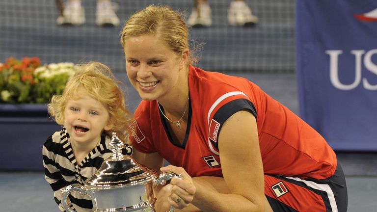 Kim Clijsters from Belgium and her daughter Jada with her trophy after defeating Caroline Wozniacki from Denmark to win the Women's Final US Open match at the USTA Billie Jean King National Tennis Center September 13, 2009 in New York