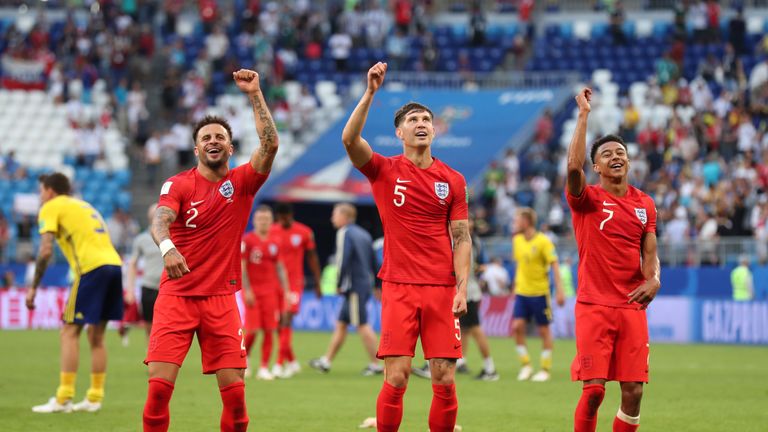 Kyle Walker (left), John Stone and Jesse Lingard celebrate England's win over Sweden