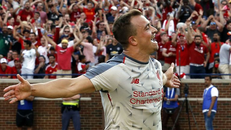 Xherdan Shaqiri (R) celebrates after scoring against the Manchester United during the second half of their 2018 International Champions Cup football match at Michigan Stadium in Ann Arbor, Michigan on July 28, 2018