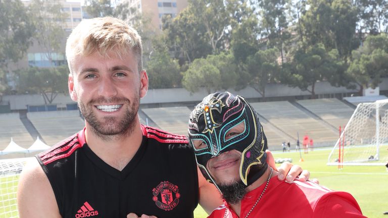 Manchester United's Luke Shaw poses with wrestler Rey Mysterio during a pre-season training session at UCLA on July 26, 2018