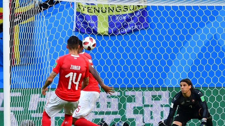 Emil Fosberg's shot is deflected off the foot of Switzerland's Manuel Akanji and past Yann Sommer to give Sweden the lead in St Petersburg