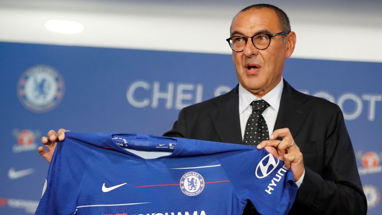 Chelsea's newly appointed manager, Maurizio Sarri, poses with a shirt during his unveiling at Stamford Bridge