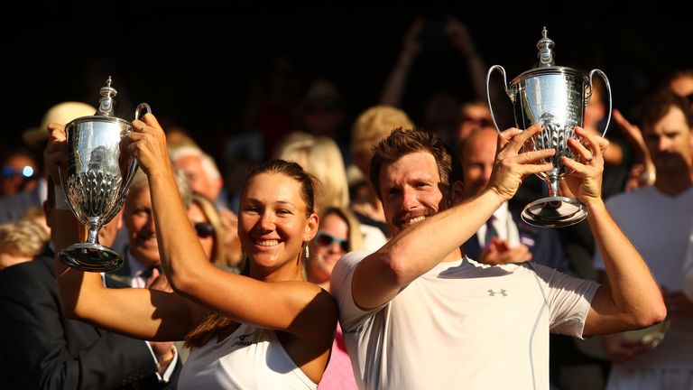 Nicole Melichar and Alexander Peya celebrate with their mixed doubles trophies