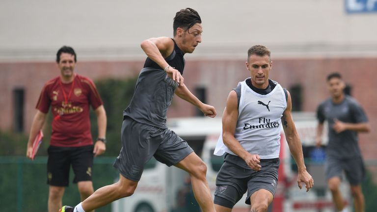 Emery watches on as Mesut Ozil prepares for the International Champions Cup in Singapore