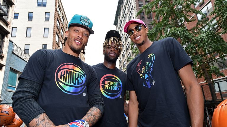 Michael Beasley of the New York Knicks, Reggie Bullock of the Detroit Pistons and John Henson of the Milwaukee Bucks pose for a photo during the NYC Pride Parade on June 24, 2018 in New York City, New York