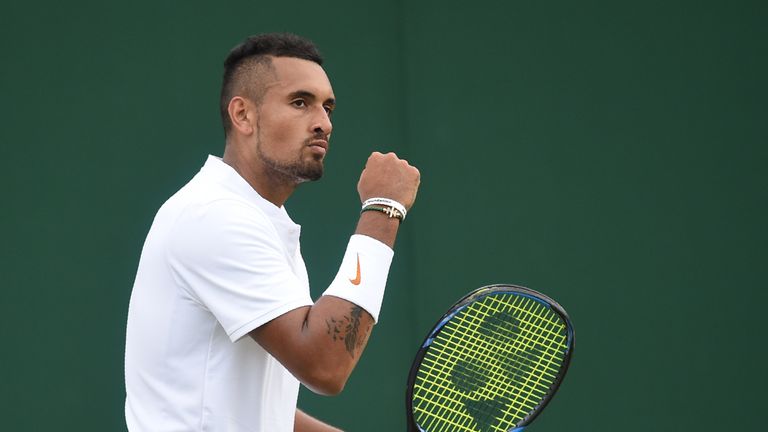 Australia's Nick Kyrgios celebrates a point against Netherland's Robin Haase in their men's singles second round match on the fourth day of the 2018 Wimbledon Championships at The All England Lawn Tennis Club in Wimbledon, southwest London, on July 5, 2018.
