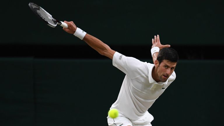 Serbia's Novak Djokovic returns against Spain's Rafael Nadal during their men's singles semi-final match on the eleventh day of the 2018 Wimbledon Championships at The All England Lawn Tennis Club in Wimbledon, southwest London, on July 13, 2018