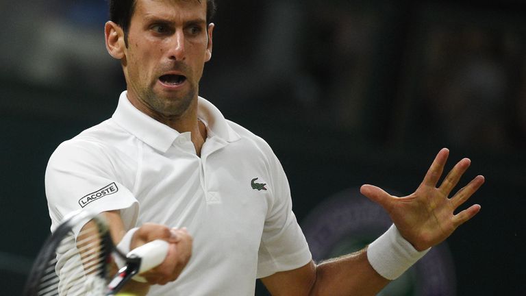 Spain's Rafael Nadal returns against Serbia's Novak Djokovic during their men's singles semi-final match on the eleventh day of the 2018 Wimbledon Championships at The All England Lawn Tennis Club in Wimbledon, southwest London, on July 13, 2018.