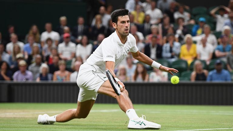 Novak Djokovic of Serbia returns against Rafael Nadal of Spain during their Men's Singles semi-final match on day eleven of the Wimbledon Lawn Tennis Championships at All England Lawn Tennis and Croquet Club on July 13, 2018 in London, England