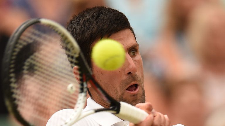 Serbia's Novak Djokovic returns against Spain's Rafael Nadal during the continuation of their men's singles semi-final match on the twelfth day of the 2018 Wimbledon Championships at The All England Lawn Tennis Club in Wimbledon, southwest London, on July 14, 2018. 
