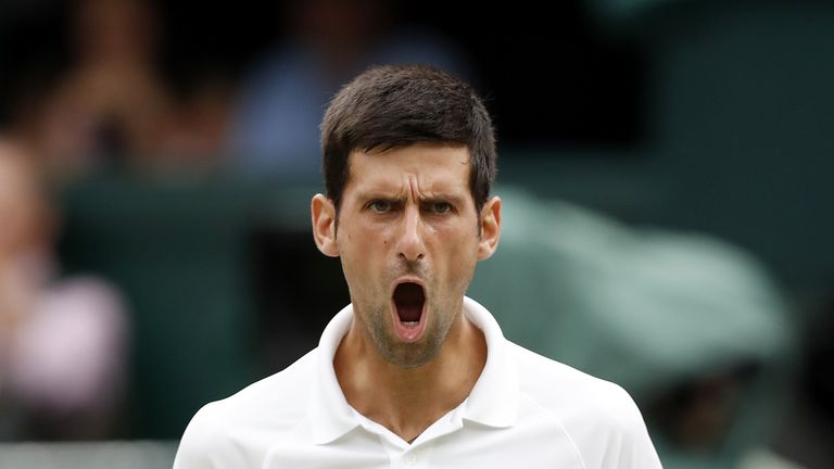 Serbia's Novak Djokovic reacts against Spain's Rafael Nadal during the continuation of their men's singles semi-final match on the twelfth day of the 2018 Wimbledon Championships at The All England Lawn Tennis Club in Wimbledon, southwest London, on July 14, 2018.