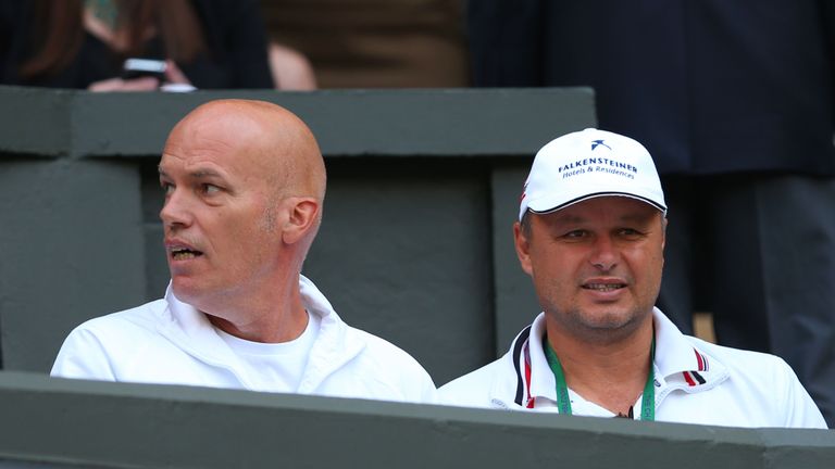 Novak Djokovic of Serbia's physical trainer Gebhard Phil-Gritsch (L) and coach Marian Vajda watch his Gentlemen's Singles first round match against Florian Mayer of Germany on day two of the Wimbledon Lawn Tennis Championships at the All England Lawn Tennis and Croquet Club on June 25, 2013 in London, England