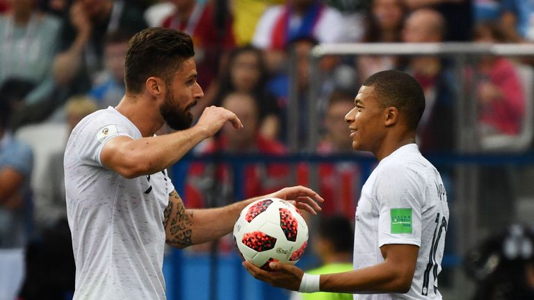 Olivier Giroud (left) talks with Kylian Mbappe during France vs Uruguay