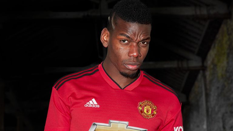 World Cup winner Paul Pogba models the new Manchester United home kit for the 2018/19 season