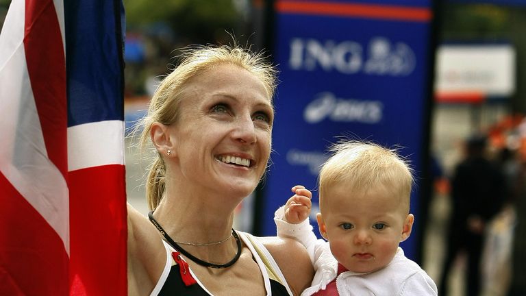 Paula Radcliffe of Britain holds her daughter Isla after winning the Women's Division of the New York City Marathon in New York 04 November 2007