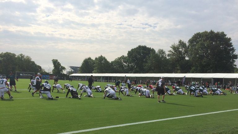 Philadelphia Eagles players perform some team stretches