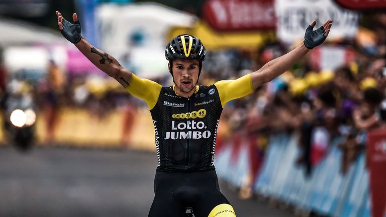 Primoz Roglic celebrates after winning stage 19