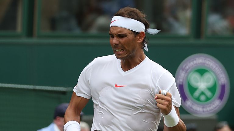 Spain's Rafael Nadal celebrates a point against Kazakhstan's Mikhail Kukushkin in their men's singles second round match on the fourth day of the 2018 Wimbledon Championships at The All England Lawn Tennis Club in Wimbledon, southwest London, on July 5, 2018. 