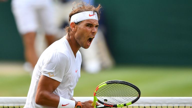 Spain's Rafael Nadal celebrates a point against Czech Repbulic's Jiri Vesely in their men's singles fourth round match on the seventh day of the 2018 Wimbledon Championships at The All England Lawn Tennis Club in Wimbledon, southwest London, on July 9, 2018. 