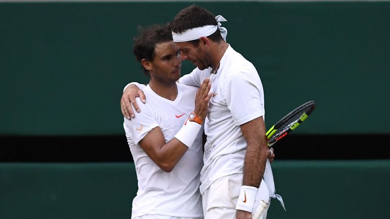 Rafael Nadal of Spain and Juan Martin Del Potro of Argentina embrace following their Men's Singles Quarter-Finals match on day nine of the Wimbledon Lawn Tennis Championships at All England Lawn Tennis and Croquet Club on July 11, 2018 in London, England. Nadal won the match 5-7, 7-6, 6-4, 4-6, 4-6 in 4hr 47min