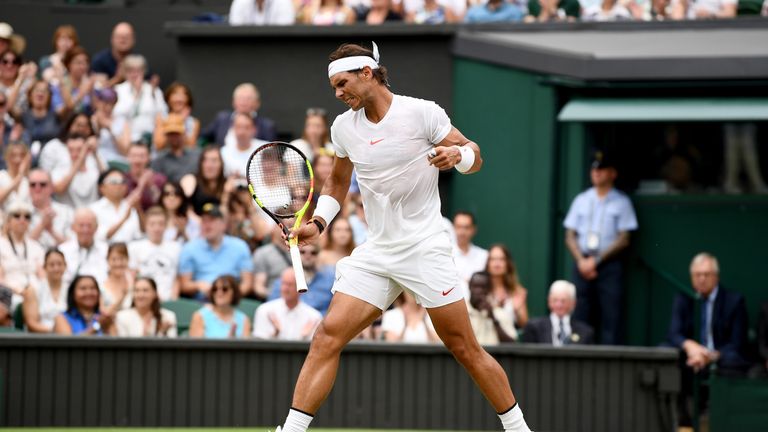 Rafael Nadal of Spain celebrates a point against Novak Djokovic of Serbia during their Men's Singles semi-final match on day twelve of the Wimbledon Lawn Tennis Championships at All England Lawn Tennis and Croquet Club on July 14, 2018 in London, England.