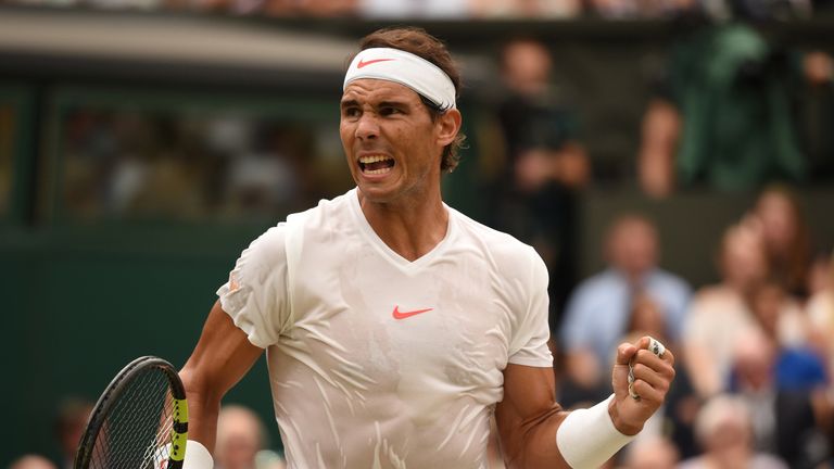 Spain's Rafael Nadal reacts after breaking serve against Serbia's Novak Djokovic during the continuation of their men's singles semi-final match on the twelfth day of the 2018 Wimbledon Championships at The All England Lawn Tennis Club in Wimbledon, southwest London, on July 14, 2018.