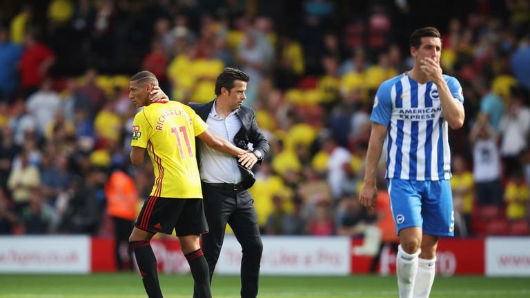Richarlison and Marco Silva, manager of Watford, embrace after the Premier League match between Watford and Brighton and Hove Albion at Vicarage Road on August 26, 2017