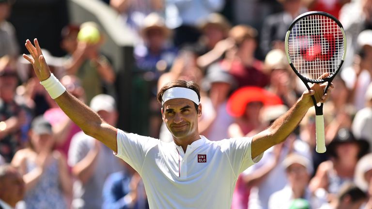 Switzerland's Roger Federer celebrates after beating Serbia's Dusan Lajovic 6-1, 6-3, 6-4 in their men's singles first round match on the first day of the 2018 Wimbledon Championships at The All England Lawn Tennis Club in Wimbledon, southwest London, on July 2, 2018. 