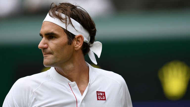 Switzerland's Roger Federer reacts against Slovakia's Lukas Lacko during their men's singles second round match on the third day of the 2018 Wimbledon Championships at The All England Lawn Tennis Club in Wimbledon, southwest London, on July 4, 2018. 