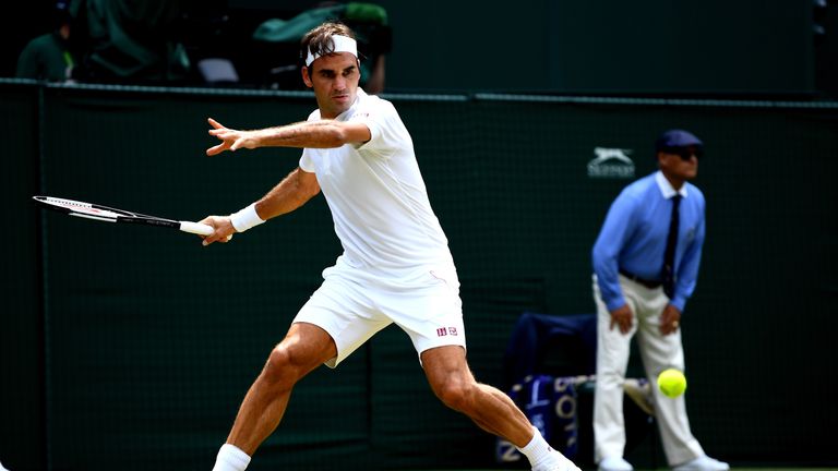 Roger Federer of Switzerland plays a forehand against Adrian Mannarino of France during their Men's Singles fourth round match on day seven of the Wimbledon Lawn Tennis Championships at All England Lawn Tennis and Croquet Club on July 9, 2018 in London, England.