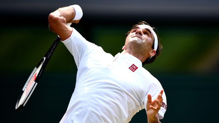 Roger Federer of Switzerland serves against Adrian Mannarino of France during their Men's Singles fourth round match on day seven of the Wimbledon Lawn Tennis Championships at All England Lawn Tennis and Croquet Club on July 9, 2018 in London, England.
