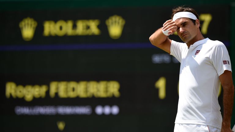 Switzerland's Roger Federer reacts as he waits to receive a serve from South Africa's Kevin Anderson during their men's singles quarter-finals match on the ninth day of the 2018 Wimbledon Championships at The All England Lawn Tennis Club in Wimbledon, southwest London, on July 11, 2018.