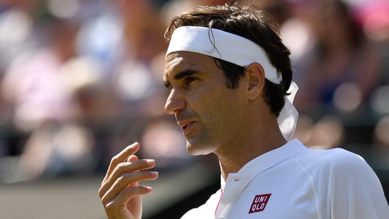 Switzerland's Roger Federer reacts against South Africa's Kevin Anderson during their men's singles quarter-finals match on the ninth day of the 2018 Wimbledon Championships at The All England Lawn Tennis Club in Wimbledon, southwest London, on July 11, 2018.
