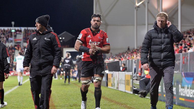 Crusaders flanker Jordan Taufua leaves the pitch after suffering a broken arm against the Hurricanes