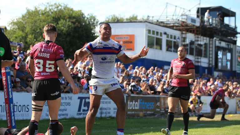 Reece Lyne celebrates scoring a try against Wakefield