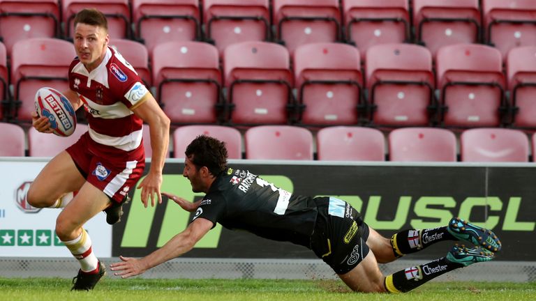 Wigan's Tom Davies crosses for the first try at the DW Stadium