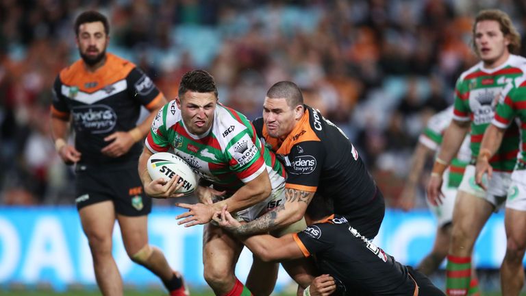 Sam Burgess of the Rabbitohs is tackled during the round 19 NRL match between the Wests Tigers and the South Sydney Rabbitohs at ANZ Stadium on July 21, 2018 in Sydney, Australia.