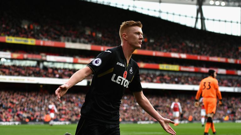 Sam Clucas celebrates during the Premier League match between Arsenal and Swansea City at Emirates Stadium on October 28, 2017 in London, England.